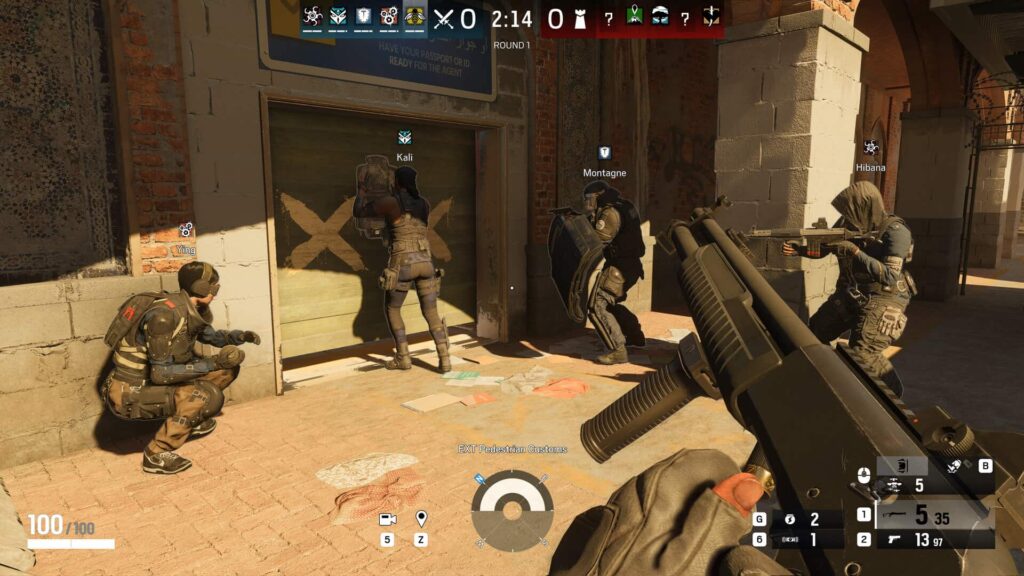 Rainbow Six Siege attackers breach a reinforced door during a coordinated push