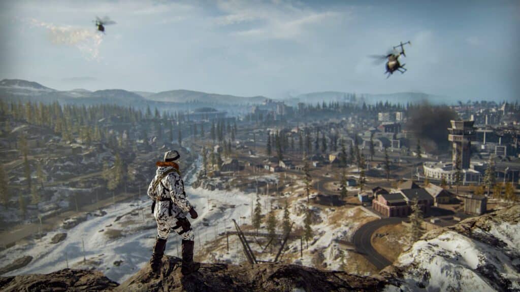 A soldier overlooking a snowy battlefield with helicopters flying above in Warzone