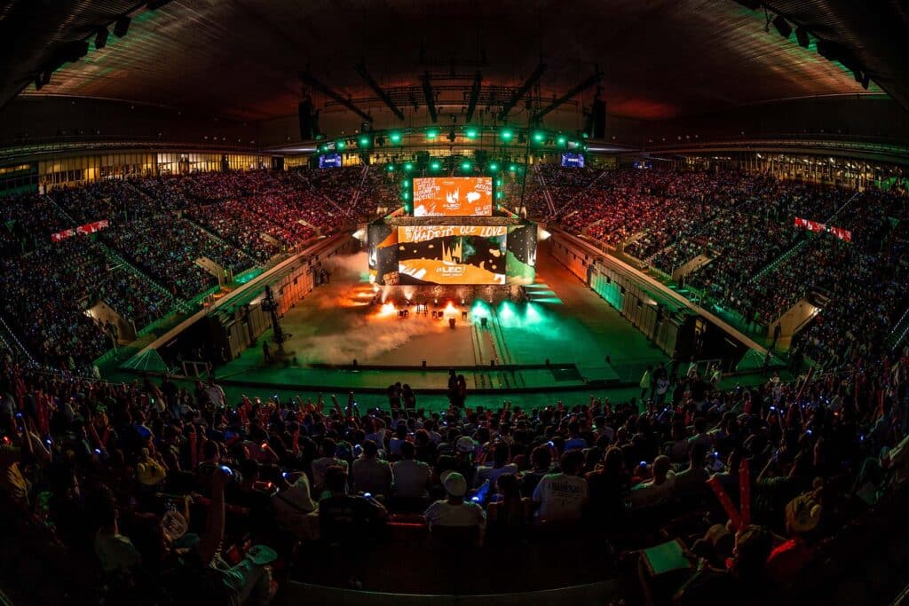 Image of LEC stage illuminated by green and orange lighting