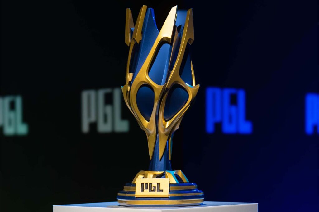 Image of PGL Masters Bucharest trophy places on top of a grey platform. The PGL logo is on a black wall in the background