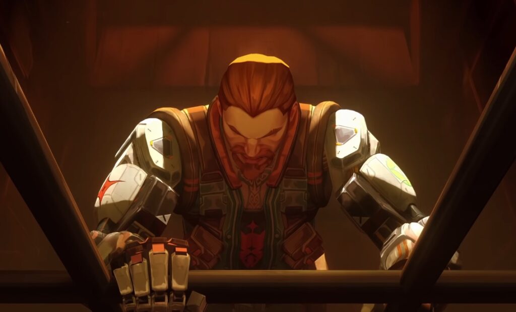 Uma ilustração do agente Valorant, Breach, um homem com barba ruiva e braços biônicos, inclinado sobre uma grade de metal em um ambiente industrial mal iluminado