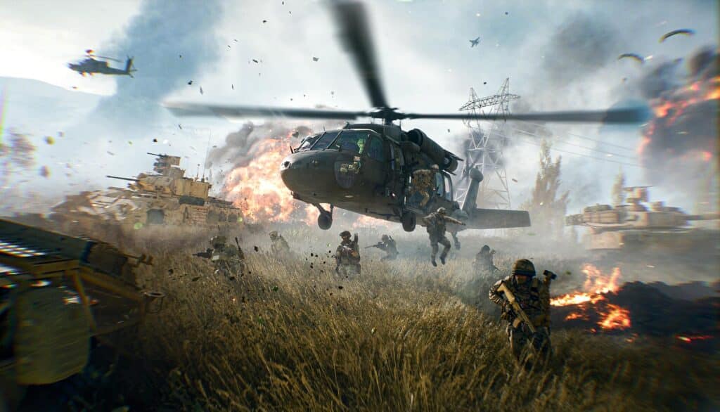 Dies ist ein Screenshot aus dem Videospiel Battlefield 6 (in frühen Materialien auch als Battlefield Redsec oder Battlefield 2042 bekannt). Das Bild zeigt eine Szene intensiver Gefechte mit Soldaten, einem UH-60 Black Hawk-Hubschrauber und gepanzerten Fahrzeugen