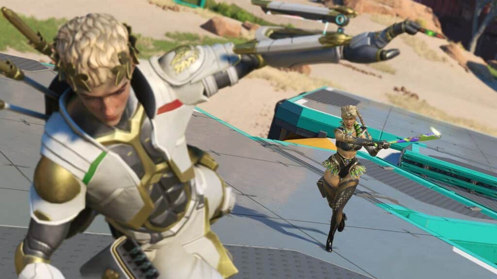 Os personagens do Apex Legends Sparrow e Loba em dourado e branco "Jogos Galácticos" skins de eventos, em uma cena de ação em um mapa rochoso e desértico