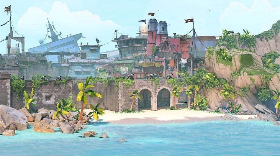Uma ilustração do "Brisa" mapa no jogo de tiro tático Valorant, mostrando uma praia em uma ilha tropical com um antigo forte de pedra e um navio de carga parcialmente naufragado ao fundo