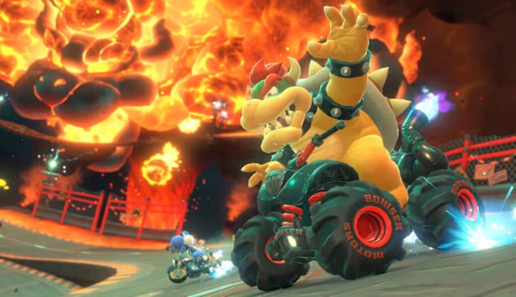 
A dynamic in-game screenshot from Mario Kart, featuring the character Bowser driving a large monster truck-style kart with "Bowser Motors" on the tires