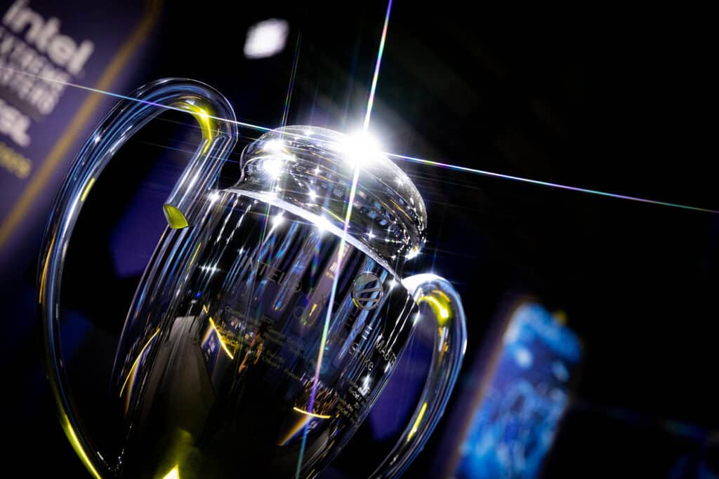 Image of ESL Counter-Strike event trophy shining in light with an esports stage in background