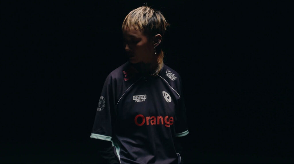 Image of woman wearing a Karmine Corp jersey designed by Fulllife on a black background