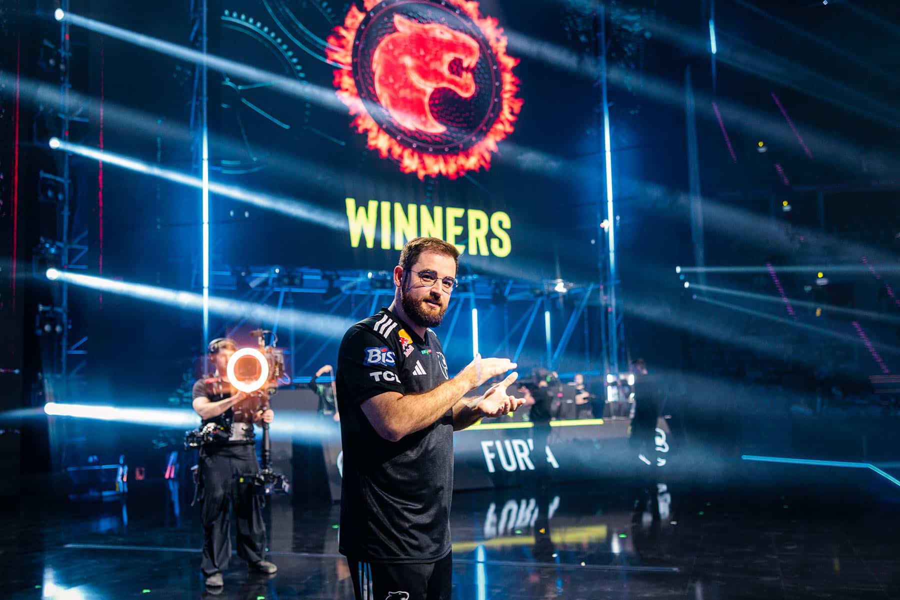 Image of FURIA Counter-Strike player FalleN applauding while on stage at IEM Krakow 2026