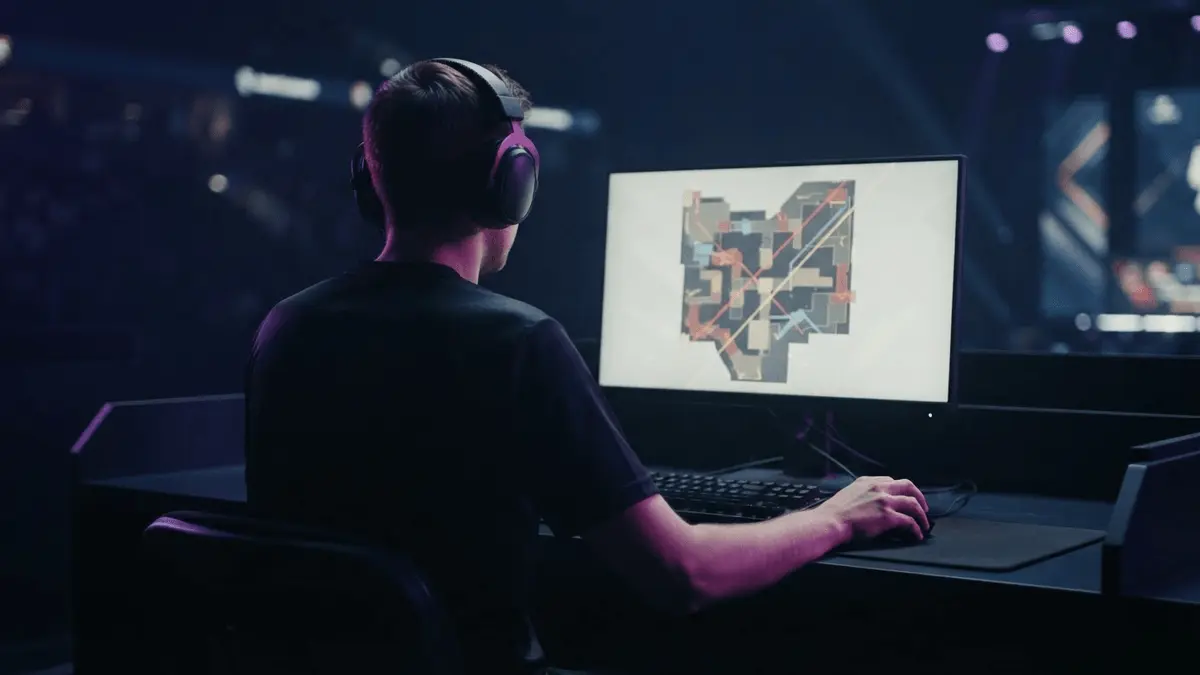 Anonymous esports player at a tournament station after a major Counter-Strike upset